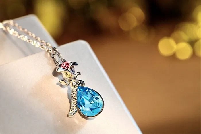Yellow Chimes Crystals from Swarovski Silver Blue Flower Designer Crystal Pendant for Women and Girls Yellow Chimes Earrings