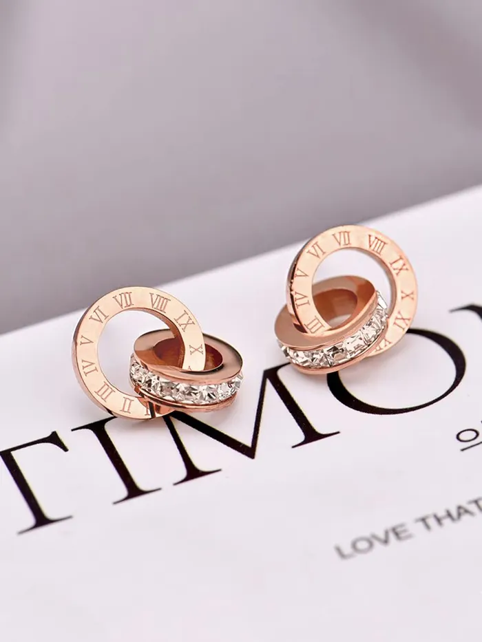 Yellow Chimes Latest Fashion Stainless Steel 18K Rose Gold Plated Roman numericals Engraved Statement Style Pendant Set with Earrings for Women and Girls Yellow Chimes Necklaces