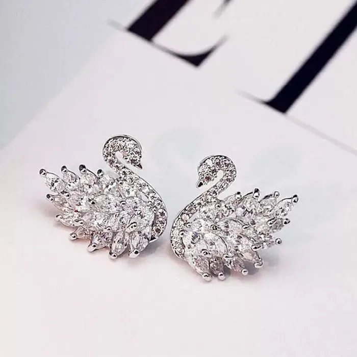 Yellow Chimes Platinum Plated Swan Design Crystal Stud Earrings for Women and Girls Yellow Chimes Earrings